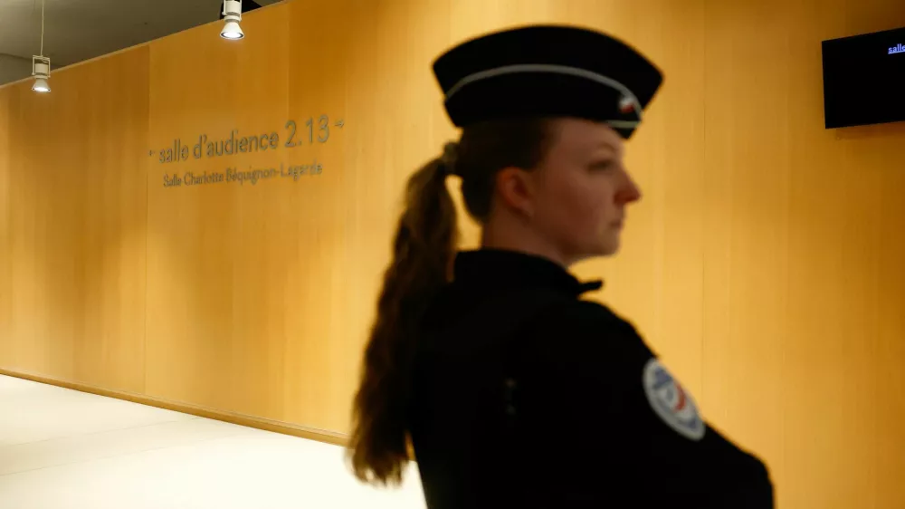French police officer stands outside the audience room on the day of the trial of French actor Gerard Depardieu for two sexual assaults allegedly committed on the set of the film "Les Volets Verts", in Paris, France, March 24, 2025. REUTERS/Sarah Meyssonnier