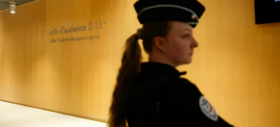 French police officer stands outside the audience room on the day of the trial of French actor Gerard Depardieu for two sexual assaults allegedly committed on the set of the film "Les Volets Verts", in Paris, France, March 24, 2025. REUTERS/Sarah Meyssonnier