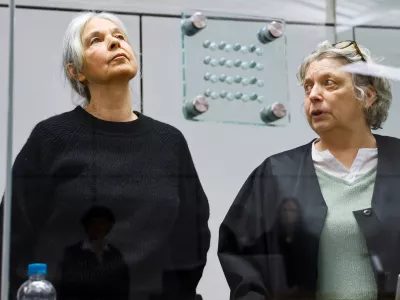 25 March 2025, Lower Saxony, Celle: Former RAF terrorist Daniela Klette (L)&nbsp;stands next to her lawyer Undine Weyers in the courtroom at Celle Higher Regional Court. The investigators accuse Klette of attempted murder, unauthorized possession of weapons as well as attempted and completed aggravated robbery. The case concerns 13 robberies of cash transporters and supermarkets in Lower Saxony, North Rhine-Westphalia and Schleswig-Holstein. Photo: Wolfgang Rattay/Reuters/Pool/dpa
