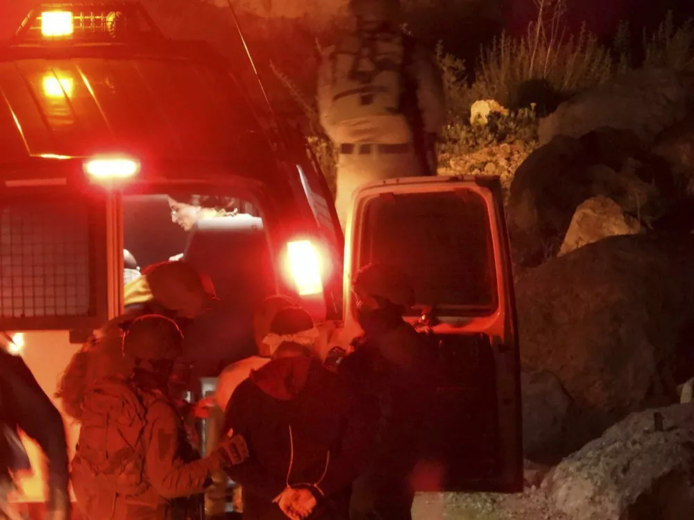 CORRECTS DATE: Hamdan Ballal, Palestinian co-director of Oscar-winning documentary No Other Land, is detained by the Israeli military from his home in the Israeli-occupied West Bank, Monday, March 24, 2025. (Raviv Rose via AP)