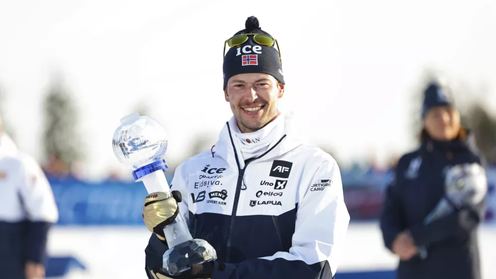 Sturla Holm L&aelig;greid of Norway wins the overall World Cup after the biathlon men's 15 km mass start at the World Cup in Holmenkollen, Norway, Sunday, March 23, 2025. (Thomas Andersen/NTB Scanpix via AP)