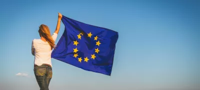 EU flag in female hands.
