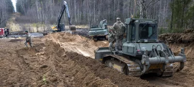 Recovery efforts continue for four missing U.S. soldiers near the spot where their Hercules armored vehicle was found submerged at a training range in Pabrade, north of the capital Vilnius, Lithuania on Thursday, March 27, 2025. (AP Photo/Mindaugas Kulbis)