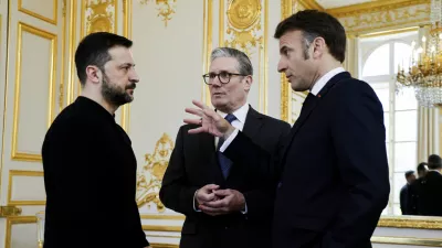 Ukraine's President Volodymyr Zelenskyy, left, French President Emmanuel Macron, right, and Britain's Prime Minister Keir Starmer speak during a trilateral meeting on the sidelines of a summit for "coalition of the willing" at the Elysee Palace, Thursday, March 27, 2025. (Ludovic Marin, Pool via AP)