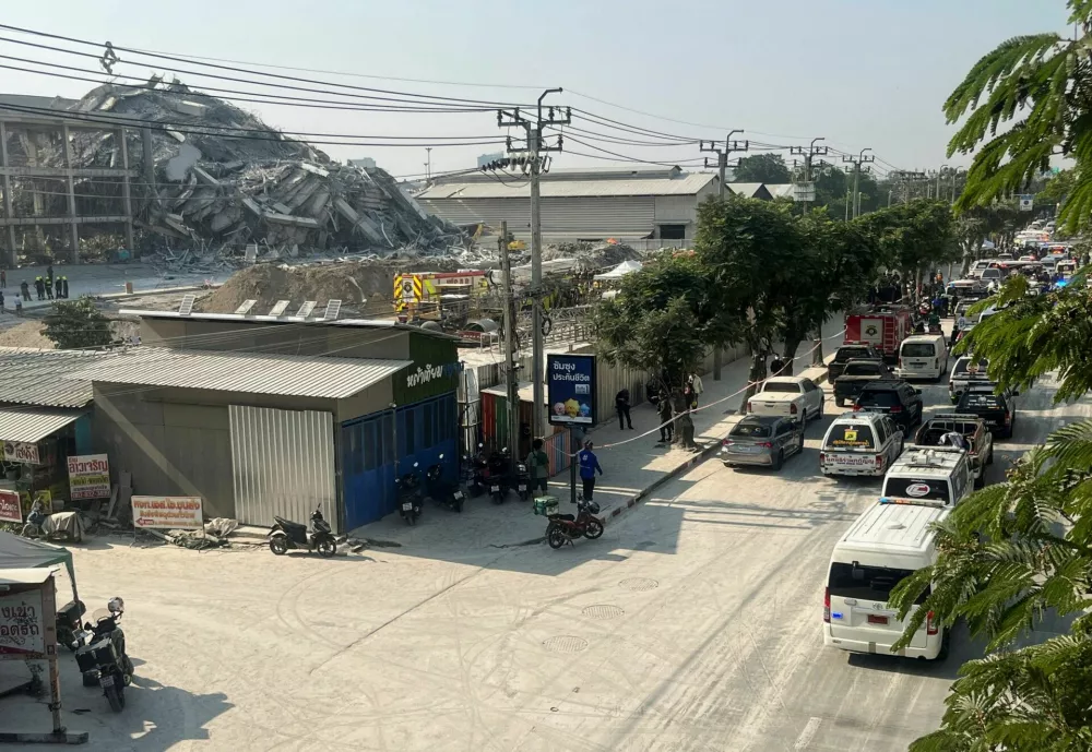 Vehicles, including emergency vehicles, are seen near the site of a collapsed building after a strong earthquake struck central Myanmar on Friday, earthquake monitoring services said, which affected Bangkok as well with hundreds of people pouring out of buildings in the Thai capital in panic after the tremors, in Bangkok, Thailand, March 28, 2025. REUTERS/Ann Wang