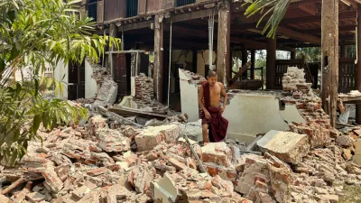 A Buddhist monk walks near a damaged building at a monastery compound after an earthquake, Friday, March 28, 2025 in Naypyitaw, Myanmar. (AP Photo/Aung Shine Oo)