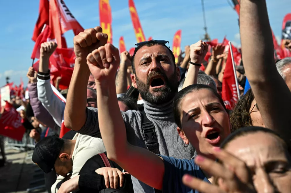 People take part in a rally to protest against the arrest of Istanbul Mayor Ekrem Imamoglu as part of a corruption investigation, in Istanbul, Turkey, March 29, 2025. REUTERS/Dylan Martinez