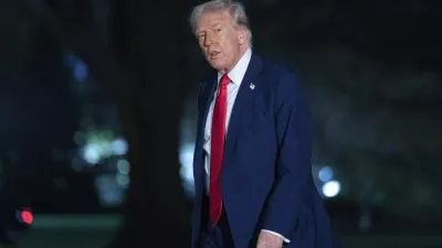 President Donald Trump talks to reporters as he walks on the South Lawn of the White House, in Washington, Sunday, March 30, 2025. (AP Photo/Jose Luis Magana)