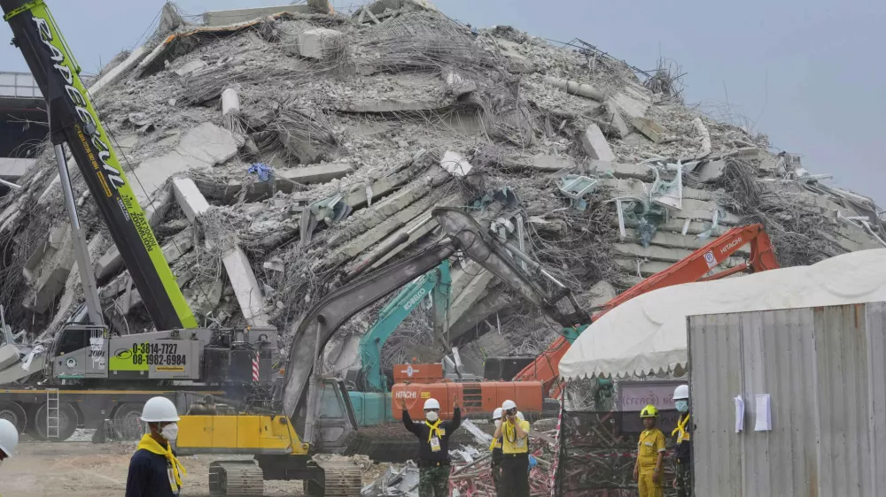 Rescuers work at the site of an under-construction high-rise building that collapsed after an earthquake in Bangkok, Thailand, Monday, March, 31, 2025. (AP Photo/Manish Swarup)
