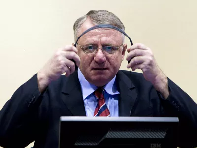 FILE - In this March 6, 2009 file photo Serbian ultranationalist leader Vojislav Seselj seen in court at the International Criminal Tribunal for the former Yugoslavia (ICTY) in The Hague, Netherlands. Seselj, 58, is to start making his closing arguments on Wednesday, March 14, 2012. Seselj has been charged with crimes against Muslims and Croats, allegedly committed by the volunteers recruited by his party during 1991-1995 war that followed the breakup of the former Yugoslavia. (AP Photo/Valerie Kuypers, Pool, File)
