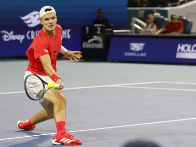 Mar 30, 2025; Miami, FL, USA; Jakub Mensik (CZE) hits a forehand against Novak Djokovic (SRB)(not pictured) in the men's singles championship of the Miami Open at Hard Rock Stadium. Mandatory Credit: Geoff Burke-Imagn Images