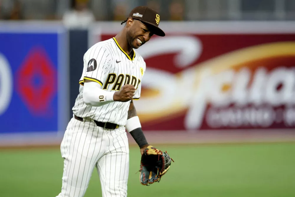 FILE PHOTO: Oct 8, 2024; San Diego, California, USA; San Diego Padres outfielder Jurickson Profar (10) celebrates after defeating the Los Angeles Dodgers during game three of the NLDS for the 2024 MLB Playoffs at Petco Park. Mandatory Credit: David Frerker-Imagn Images/File Photo