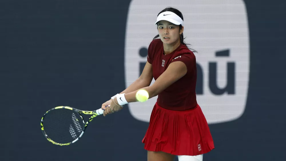 Mar 26, 2025; Miami, FL, USA; Alexandra Eala (PHL) hits a backhand against Iga Swiatek (POL)(not pictured) on day nine of the Miami Open at Hard Rock Stadium. Mandatory Credit: Geoff Burke-Imagn Images