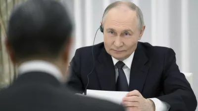 Russian President Vladimir Putin listens to Chinese Foreign Minister Wang Yi during their meeting at the Kremlin in Moscow, Russia, Tuesday, April 1, 2025. (Grigory Sysoyev, Sputnik, Kremlin Pool Photo via AP)