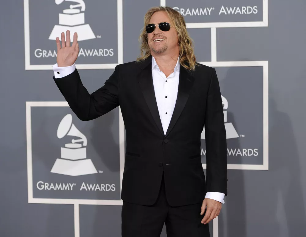 FILE - Val Kilmer arrives at the 54th annual GRAMMY Awards, Feb. 12, 2012, in Los Angeles. (AP Photo/Chris Pizzello, File)