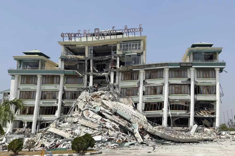 Rescuers work at damaged buildings in the aftermath of Friday's earthquake, in Naypyitaw, Myanmar, Wednesday, April 2, 2025. (AP Photo)