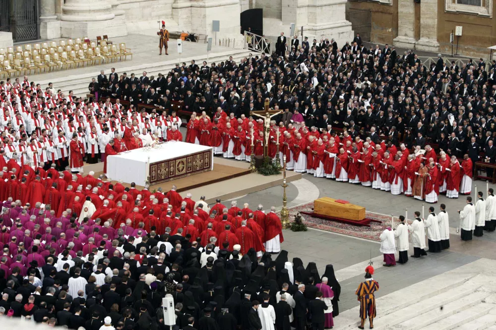 Dignitaries and cardinals attend the funeral of Pope John Paul II at St. Peter's Basilica at the Vatican, Friday April 8, 2005. Royalty, political power brokers and multitudes of the faithful paid their last respects to Pope at a funeral promising to be one of the largest Western religious gatherings of modern times. (AP Photo/Lefteris Pitarakis)