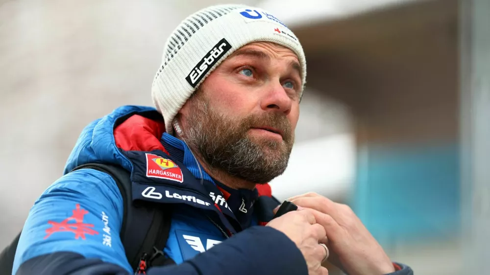Ski Jumping - Four Hills Tournament - Bischofshofen, Austria - January 5, 2025 Austria mens national team head coach Andreas Widhoelzl is pictured on his way to training ahead of the event REUTERS/Lisi Niesner