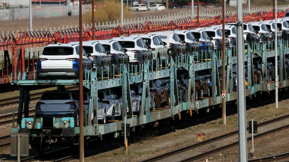 FILE PHOTO: Cars of the Volkswagen Group intended for export to the United States and the United Kingdom arrive on train carriages in Emden, Germany, April 2, 2025. REUTERS/Wolfgang Rattay/File Photo