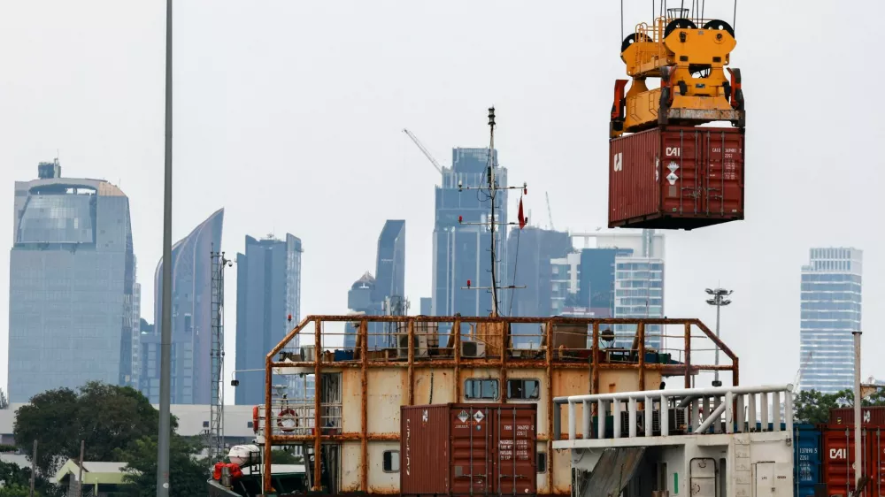 A container is loaded onto a cargo ship while docked at the port of Bangkok, in Bangkok, Thailand, April 3, 2025. Thailand, with a tariff rate of 37 per cent imposed by U.S. President Donald Trump, is one of the six countries in the Southeast Asian region slapped with much higher-than-expected traffis by the U.S. REUTERS/Athit Perawongmetha