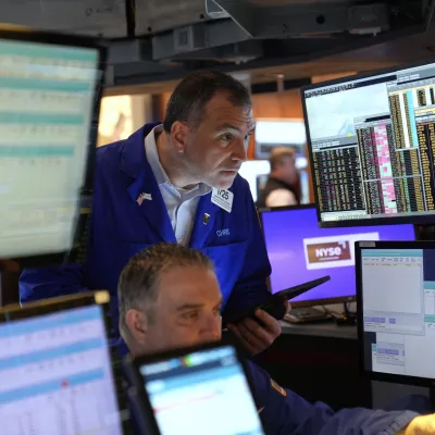 Traders, including Christopher Lagana, center, work on the floor at the New York Stock Exchange in New York, Wednesday, April 2, 2025. (AP Photo/Seth Wenig)