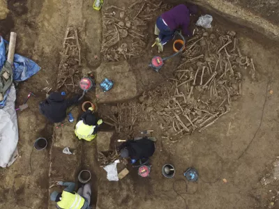 People work on the excavation of a Roman mass grave from the end of the 1st century AD, in the Simmering district of Vienna, Austria, Thursday, Nov. 7, 2024. (A. Slonek/Novetus via AP)