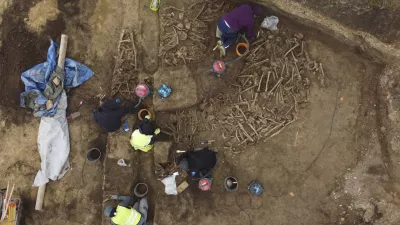 People work on the excavation of a Roman mass grave from the end of the 1st century AD, in the Simmering district of Vienna, Austria, Thursday, Nov. 7, 2024. (A. Slonek/Novetus via AP)