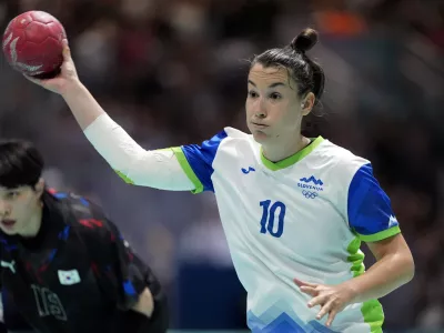 Tjasa Stanko, of Slovenia, prepares to shoot the ball past Han Miseul, of South Korea, during a women's handball match at the 2024 Summer Olympics, Sunday, July 28, 2024, in Paris, France. (AP Photo/Brian Inganga)