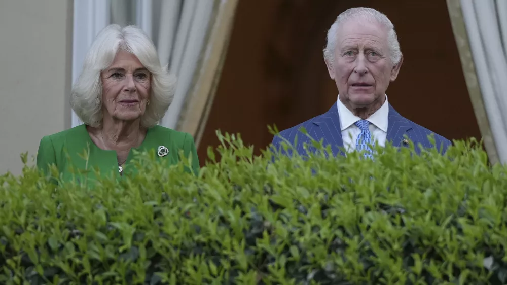 King Charles III, right, and Queen Camilla listen to the band of the Welsh Guards as they arrive at the Residence of the British Ambassador to Italy Villa Wolkonsky in Rome, Tuesday, April 8, 2025 to meet with memebers of the British community in Italy. (AP Photo/Andrew Medichini)