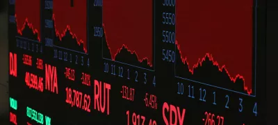 A screen shows trading indexes at the New York Stock Exchange (NYSE) in New York City, U.S., April 3, 2025. REUTERS/Brendan McDermid
