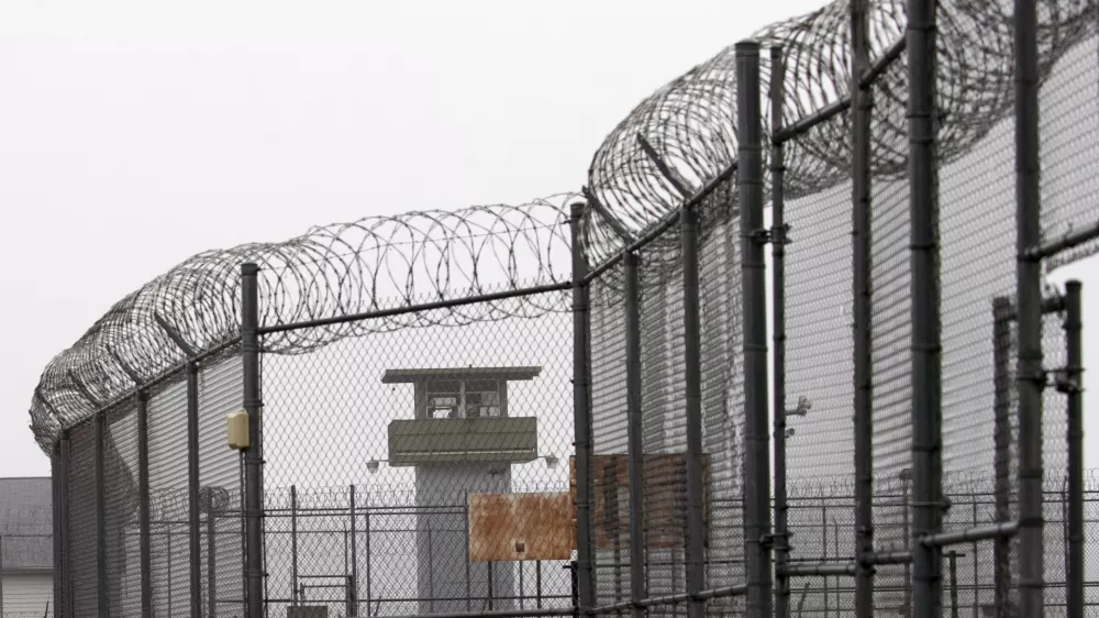 FILE - A guard tower and barbed wire fencing stand outside Sing Sing, Sunday, Feb. 16, 2020 in Ossining, N.Y. (AP Photo/Mark Lennihan, File)