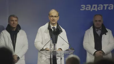 Djuro Macut, center, a politically inexperienced medical professor and nominated to become Serbia's prime minister, speaks during a rally in a central town of Jagodina, Serbia, Friday, Jan. 24, 2025. (AP Photo/Antonio Ahel)
