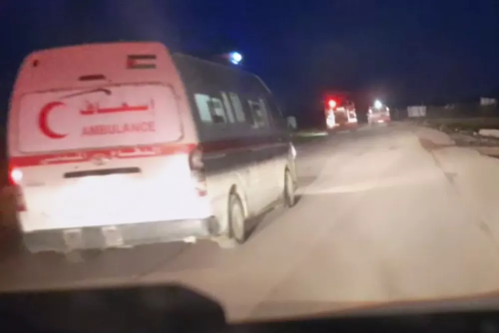 This frame grab from a video released by the Palestinian Red Crescent Society, taken with a phone by one of the 15 Palestinians medics killed, shows Red Crescent emergency vehicles, their lights and sirens flashing and their logos clearly visible, seconds before they came under a barrage of gunfire from Israeli army soldiers in Tel al-Sultan, a district of the southern Gaza Strip town of Rafah, early Sunday, March 23, 2025. (Palestinian Red Crescent Society via AP)