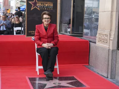 Billie Jean King poses with her new star at a ceremony on the Hollywood Walk of Fame on Monday, April 7, 2025, in Los Angeles. (AP Photo/Chris Pizzello)