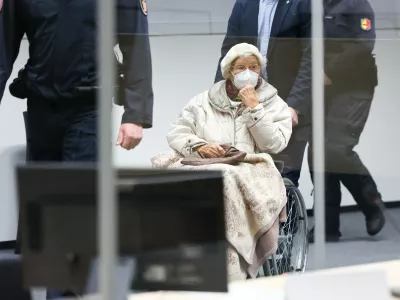 FILED - 20 December 2022, Itzehoe: The defendant Irmgard F.,charged with aiding mass murder in over 11,000 cases in the Stutthof concentration camp, is brought into the courtroom at the beginning in Itzehoe. The 99-year-old former secretary at the Stutthof concentration camp convicted for aiding and abetting the mass murder of more than 10,000 people between June 1943 and April 1945 has died, prosecutors said on&nbsp;Monday. Photo: Christian Charisius/dpa/Pool/dpa