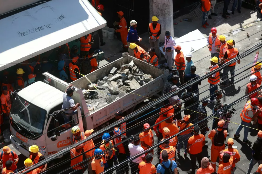 People work at the site where the roof of the Jet Set nightclub collapsed, in Santo Domingo, Dominican Republic, April 8, 2025. REUTERS/Erika Santelices