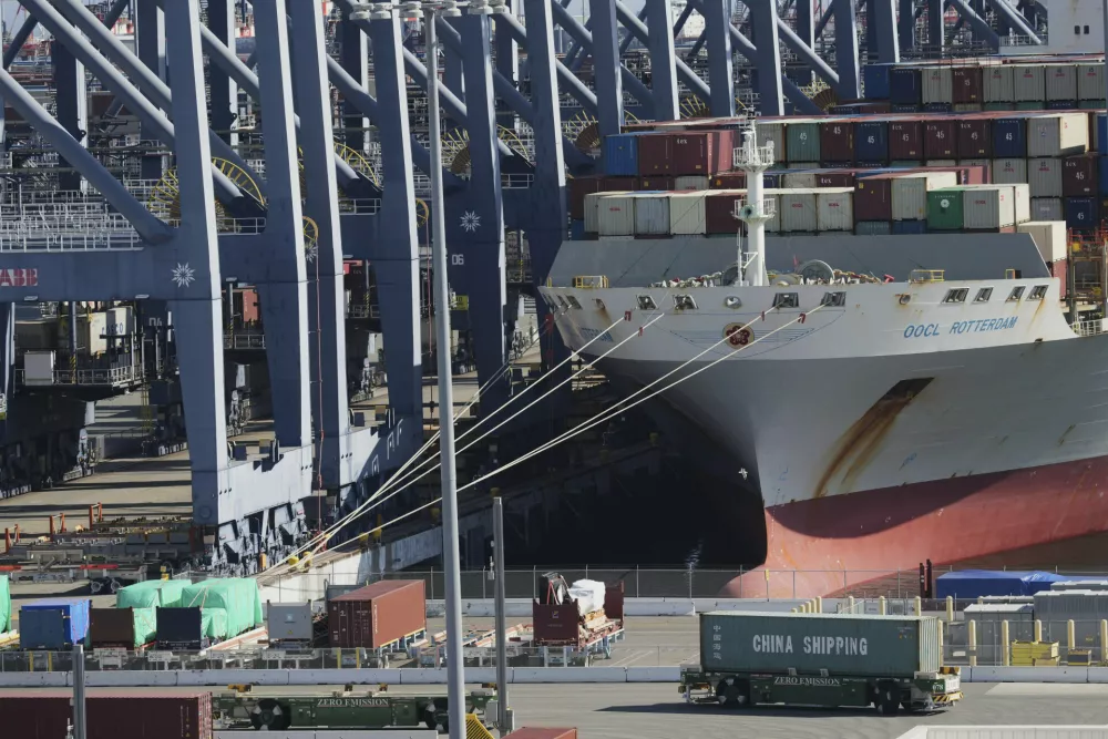 The "OOCL Rotterdam" is moored at the Long Beach Container Terminal, LBCT, in the Port of Long Beach, Calif., Tuesday, April 8, 2025. (AP Photo/Damian Dovarganes)