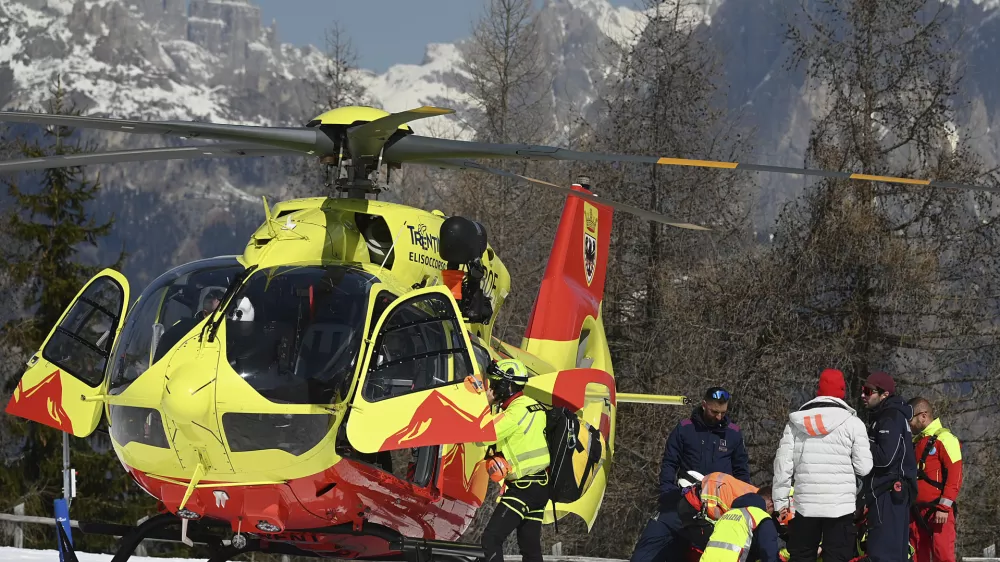 Italy's Federica Brignone is assisted before being flown by helicopter to an hospital, after she broke multiple bones in her left leg during a giant slalom crash at the Italian championships in the Lusia ski area, in Val di Fassa, Italy, Thursday, April 3, 2025. (AP Photo/Elvis Piazzi)