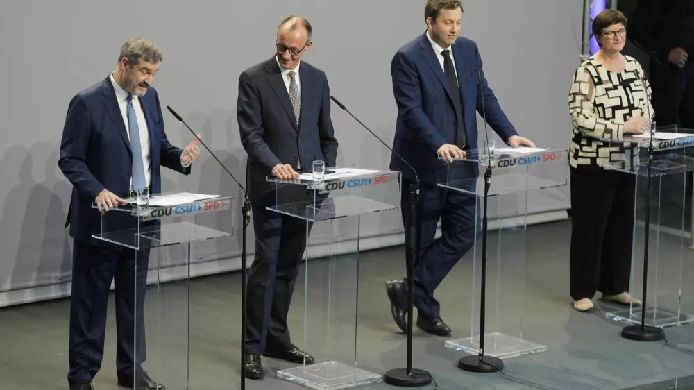 Markus Soeder, chairman of Bavarian&yen;s Christian Social Union party, Friedrich Merz, Christian Democratic Union party chairman and the Social Democratic Party co-leaders Lars Klingbeil and Saskia Esken, brief the media after reaching an agreement between their parties on a coalition for a new German government at a news conference in Berlin, Germany, Wednesday, April 9, 2025. (AP Photo/Markus Schreiber)