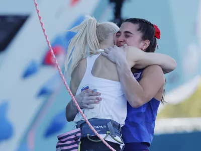 Paris 2024 Olympics - Climbing - Women's Boulder & Lead, Final Lead - Le Bourget Sport Climbing Venue, Le Bourget, France - August 10, 2024. Erin Gold medallist Janja Garnbret of Slovenia and silver medallist Brooke Raboutou of United States celebrate. REUTERS/Anushree Fadnavis