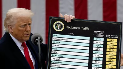 FILE PHOTO: U.S. President Donald Trump delivers remarks on tariffs at the White House in Washington, D.C., U.S., April 2, 2025. REUTERS/Carlos Barria/File Photo