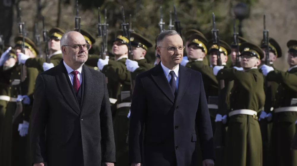 Estonian President Alar Karis, left, and Poland's President Andrzej Duda review the honor guard during their meeting at Kadriorg Palace in Tallinn, Estonia, Tuesday, April 8, 2025. (AP Photo/Sergei Grits)