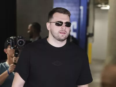 Los Angeles Lakers' Luka Doncic arrives at American Airlines Center for an NBA basketball game against the Dallas Mavericks in Dallas, Wednesday, April 9, 2025. (AP Photo/LM Otero)