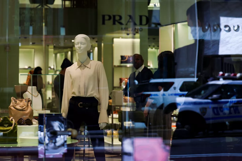 Clothes and bags are displayed at a Prada store in New York City, U.S., April 8, 2025. REUTERS/Jeenah Moon