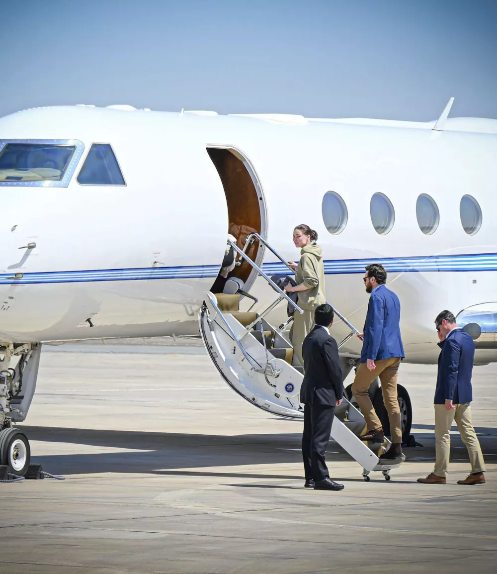 This photo released by the state-run WAM news agency shows U.S.-Russian dual national Ksenia Karelina getting on a private jet after her release at an airport in Abu Dhabi, United Arab Emirates, Thursday, April 10, 2025. (WAM via AP)