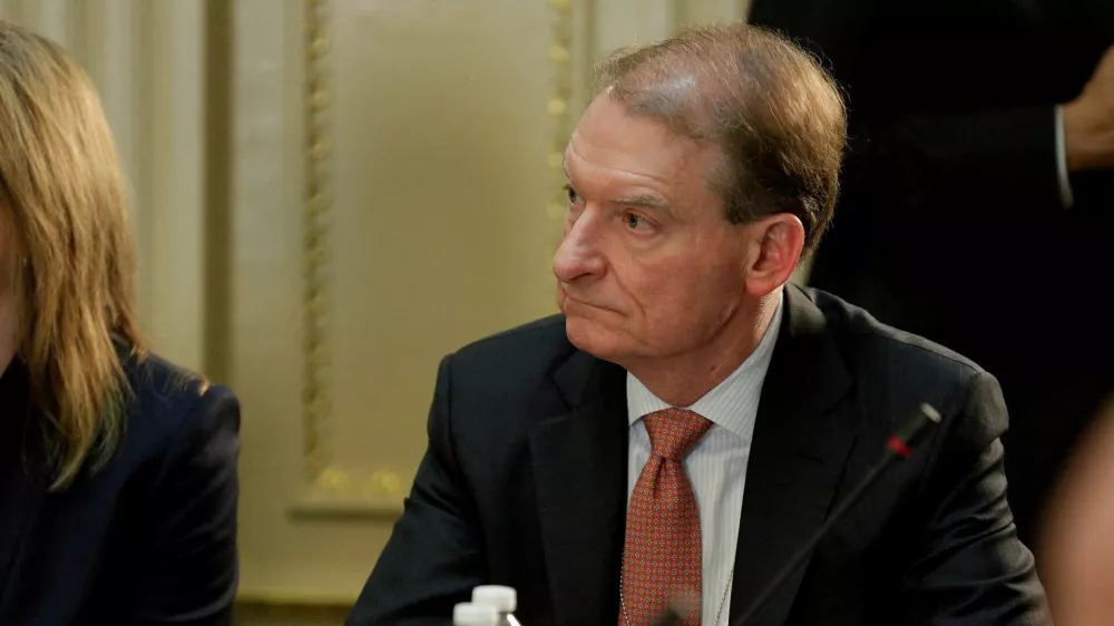 FILE PHOTO: CEO of Patomak Global Partners Paul Atkins takes part in a strategic and policy CEO discussion with U.S. President Donald Trump in the Eisenhower Execution Office Building in Washington, U.S., April 11, 2017. REUTERS/Joshua Roberts/File Photo