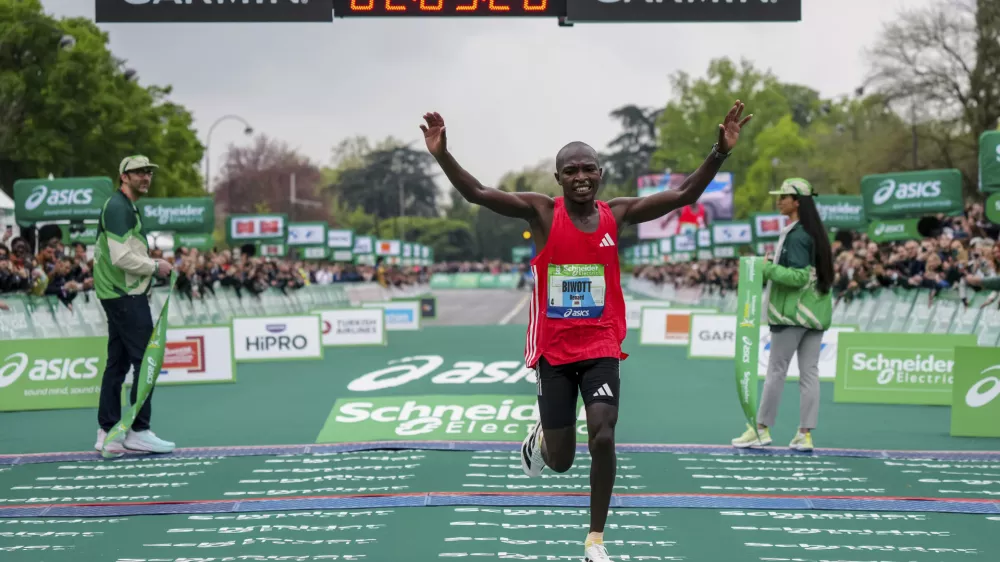 Benard Biwott of Kenya crosses the finish line to win the men's race of the Paris marathon, in Paris, Sunday, April 13, 2025. (AP Photo/Aurelien Morissard)
