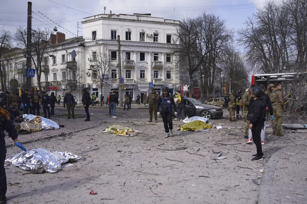 Bodies of killed residents lie on the ground following Russia's missile attack that killed at least 21 civilians in Sumy, Ukraine, Sunday, April 13, 2025. (AP Photo/str)