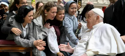Pope Francis meets with people as he unexpectedly appears during the Palm Sunday Mass in Saint Peter's Square at the Vatican, April 13, 2024.  Vatican Media/­Handout via REUTERS  ATTENTION EDITORS - THIS IMAGE WAS PROVIDED BY A THIRD PARTY.
