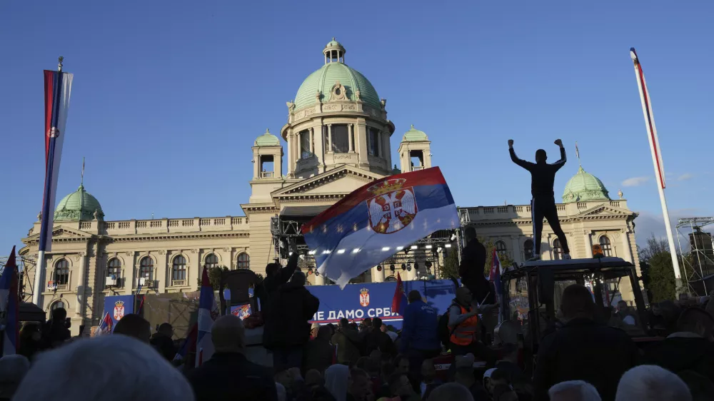 Supporters of Serbia's President Aleksandar Vucic gather during a rally in his support, apparently designed to counter student-led gatherings, in Belgrade, Serbia, Saturday, April 12, 2025. (AP Photo/Darko Vojinovic)